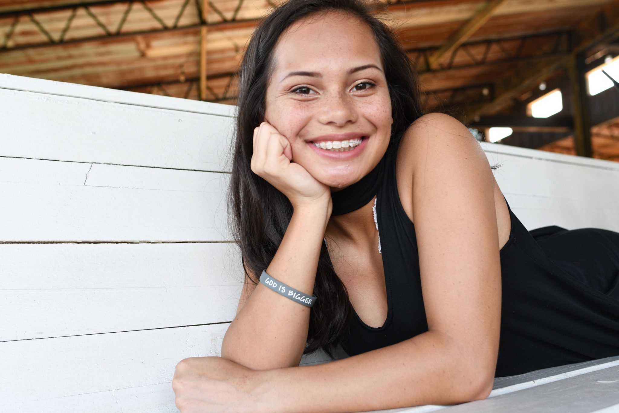 brown-eyes-brown-hair-braces-teenage-girl-7FG2TKU-scaled-1 young woman smiling